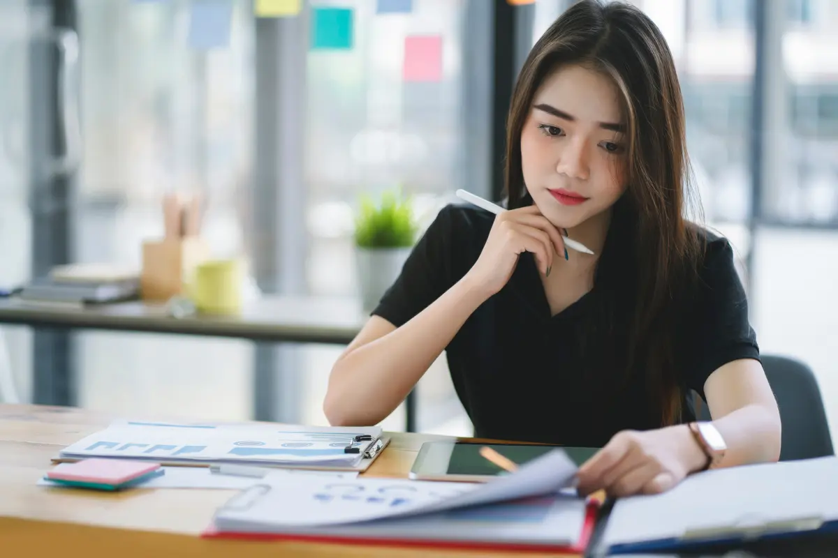 Business owner planning to renew business license by reviewing renewal business permit documentation and expiration dates to maintain compliance.