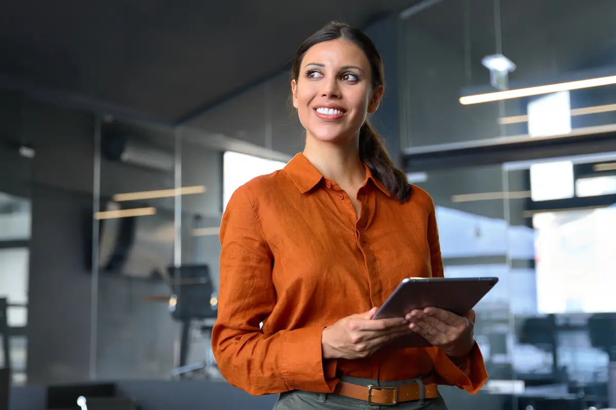 Business owner researching EIN requirements for her LLC on a tablet