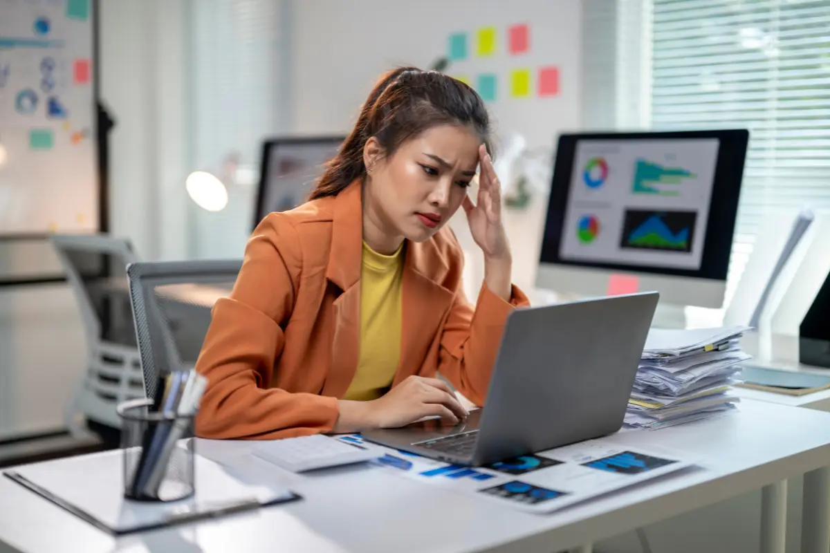 Stressed business owner discovering her company is dissolved and researching how to reinstate a dissolved company and understand dissolved company liabilities.